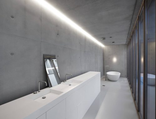 Smalle lange badkamer met een stoer, minimalistisch en modern ontwerp
