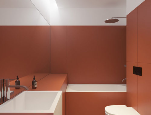Strakke moderne rode badkamer met een praktische compacte indeling