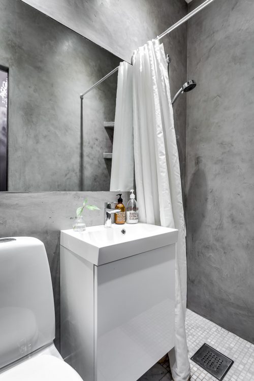 Tip voor een kleine badkamer: betonstuc!